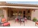 Covered patio featuring stylish outdoor seating and elegant decor for relaxing and entertaining at 10796 E Betony Dr, Scottsdale, AZ 85255