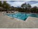 A landscape-level view of a pool area with chairs, tables, desert landscaping, and a mountain view at 10796 E Betony Dr, Scottsdale, AZ 85255