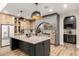 Chef's kitchen boasts custom cabinetry, large island, and pendant lighting at 1109 W Las Palmaritas Dr, Phoenix, AZ 85021