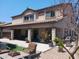Enjoy outdoor living on the covered patio, complemented by a well-maintained yard and easy access to a grill at 11219 N 165Th Ave, Surprise, AZ 85388