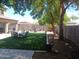 The manicured backyard offers ample space for recreation, featuring lush artificial turf and a patio for outdoor relaxation at 11219 N 165Th Ave, Surprise, AZ 85388