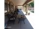 A covered patio offers shade and comfort for outdoor relaxation, leading to a spacious yard perfect for entertainment at 11219 N 165Th Ave, Surprise, AZ 85388
