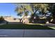 Secluded backyard featuring artificial turf, mature trees and bench at 11219 N 165Th Ave, Surprise, AZ 85388