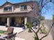 A partially covered patio and landscaped backyard create a tranquil outdoor setting for relaxation and gatherings at 11219 N 165Th Ave, Surprise, AZ 85388