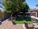 This beautiful backyard includes artificial turf and lots of room to relax and enjoy the outdoors at 11219 N 165Th Ave, Surprise, AZ 85388