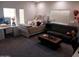 A cozy bedroom features a large bed, desk, and a plush couch at 11219 N 165Th Ave, Surprise, AZ 85388