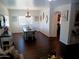 Cozy dining area with a chandelier and hardwood floors, adjacent to the living room at 11219 N 165Th Ave, Surprise, AZ 85388