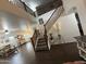 Stunning entryway with soaring ceilings, a wooden staircase, and views into the living spaces at 11219 N 165Th Ave, Surprise, AZ 85388