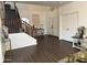 Inviting entryway featuring stylish flooring, a staircase, and a convenient coat closet at 11219 N 165Th Ave, Surprise, AZ 85388