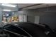 Cluttered garage features ample storage with a vehicle parked at 11219 N 165Th Ave, Surprise, AZ 85388