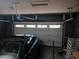 An attached garage boasts a paneled door, ample space for parking and storage at 11219 N 165Th Ave, Surprise, AZ 85388