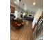 Open kitchen with a center island and stainless appliances flowing into the living space at 11219 N 165Th Ave, Surprise, AZ 85388