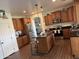Well-appointed kitchen with stainless steel appliances, a center island, and dark countertops at 11219 N 165Th Ave, Surprise, AZ 85388
