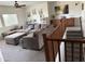 Carpeted Gathering room features a grey sectional sofa with stairs to the second level at 11219 N 165Th Ave, Surprise, AZ 85388