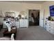Inviting living room featuring neutral walls, carpet, and doorway to stairs at 11219 N 165Th Ave, Surprise, AZ 85388