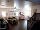 Bright living room featuring hardwood floors, an open floorplan, and staircase at 11219 N 165Th Ave, Surprise, AZ 85388