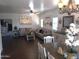 Large living room and dining area featuring hardwood floors and neutral walls at 11219 N 165Th Ave, Surprise, AZ 85388