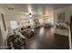Open-concept living room and dining area featuring updated flooring, ample natural light, and stylish decor at 11219 N 165Th Ave, Surprise, AZ 85388