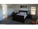 This comfortable main bedroom includes a plush bed, stylish lamps, and an ensuite bathroom for added convenience at 11219 N 165Th Ave, Surprise, AZ 85388