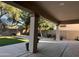 Large covered patio with a view of the artificial grass backyard at 11219 N 165Th Ave, Surprise, AZ 85388