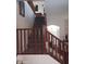 Carpeted staircase with wood banisters leads to the upper level at 11219 N 165Th Ave, Surprise, AZ 85388