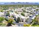 An aerial view displays the community with desert landscaping and mountain views on the horizon at 11333 N 92Nd St # 2080, Scottsdale, AZ 85260