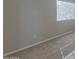 Bright room with plush carpeting, white trim, and a large window providing ample natural light at 11333 N 92Nd St # 2080, Scottsdale, AZ 85260