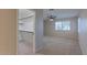 Carpeted bedroom with a ceiling fan and a walk-in closet at 11333 N 92Nd St # 2080, Scottsdale, AZ 85260