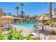 Enjoy the community pool, complete with sun umbrellas, lounge chairs, and lush desert landscaping at 11333 N 92Nd St # 2080, Scottsdale, AZ 85260