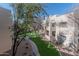Condominium featuring stucco walls and lush landscaping at 11333 N 92Nd St # 2080, Scottsdale, AZ 85260