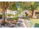 Charming courtyard setting with a winding walkway surrounded by lush greenery at 11333 N 92Nd St # 2080, Scottsdale, AZ 85260