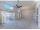 Bright living room with high ceilings, a ceiling fan, and a sliding door to the patio at 11333 N 92Nd St # 2080, Scottsdale, AZ 85260