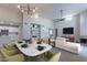 Open-concept living area featuring modern decor, built-in shelves, fireplace, and adjacent kitchen at 11333 N 92Nd St # 2080, Scottsdale, AZ 85260
