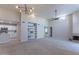Open living space with a modern chandelier, a fireplace, and built-in shelving at 11333 N 92Nd St # 2080, Scottsdale, AZ 85260
