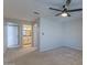 Carpeted primary bedroom featuring a ceiling fan and an ensuite bathroom at 11333 N 92Nd St # 2080, Scottsdale, AZ 85260