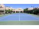 Well-maintained community tennis court with manicured landscaping and neighborhood buildings in the background at 11333 N 92Nd St # 2080, Scottsdale, AZ 85260