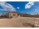 Backyard features low-maintenance gravel, block wall and covered patio at 1178 E Tyler Ln, Casa Grande, AZ 85122