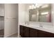 Bathroom features a dual sink vanity, large mirror, and shower/tub at 1178 E Tyler Ln, Casa Grande, AZ 85122