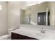 Bathroom has a single sink vanity with dark cabinets and a shower/tub combo at 1178 E Tyler Ln, Casa Grande, AZ 85122