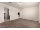 Spacious bedroom has neutral walls, carpet, and connects to another room at 1178 E Tyler Ln, Casa Grande, AZ 85122