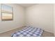 Cozy bedroom has natural light and plush carpeting at 1178 E Tyler Ln, Casa Grande, AZ 85122