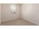 Bedroom offers a window for natural light and plush carpeting at 1178 E Tyler Ln, Casa Grande, AZ 85122