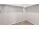 Walk-in closet features built-in rods for ample clothing storage at 1178 E Tyler Ln, Casa Grande, AZ 85122