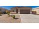 Charming single-story home with a well-maintained yard and two-car garage, perfect for comfortable living at 1178 E Tyler Ln, Casa Grande, AZ 85122
