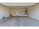 Spacious two car garage with ample room for parking and storage with a water heater at 1178 E Tyler Ln, Casa Grande, AZ 85122