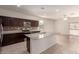 Modern kitchen with granite countertops, stainless steel appliances, and an island, perfect for cooking and entertaining at 1178 E Tyler Ln, Casa Grande, AZ 85122