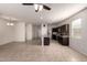 Bright and spacious living area with tile flooring, kitchen island, and modern fixtures, perfect for gatherings at 1178 E Tyler Ln, Casa Grande, AZ 85122