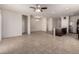 Open-concept living room with tile flooring, recessed lighting, and seamless flow to the kitchen at 1178 E Tyler Ln, Casa Grande, AZ 85122