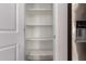 Bright pantry featuring multiple shelves for optimized storage and organization at 1178 E Tyler Ln, Casa Grande, AZ 85122