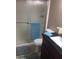 Clean bathroom with a frosted glass shower door and neutral colors at 12123 W Bell Rd # 118, Surprise, AZ 85378